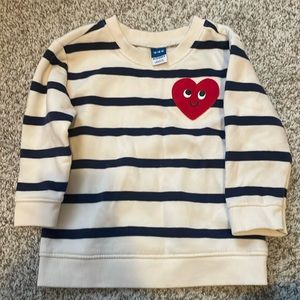 Baby girl stripped sweatshirt with red heart.